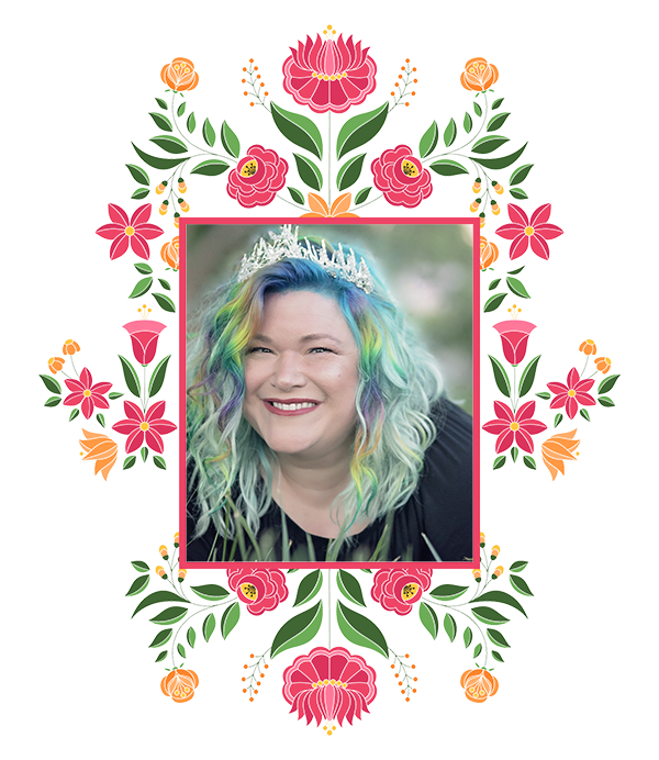 Sarah Badass Bridger with pastel rainbow hair and a tiara in a Mexican floral border
